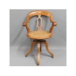 An antique oak captains chair with cane seat, some