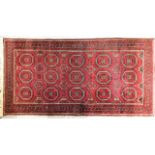 A vintage decorative wool rug, 76in x 39.5in