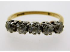 An antique 18ct gold ring set with five old cut di