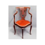 An Edwardian upholstered corner chair, 34in high t