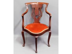 An Edwardian upholstered corner chair, 34in high t