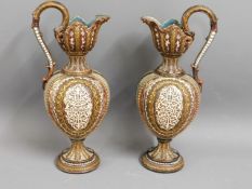 A pair of German majolica ewers, 14.125in tall