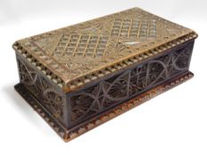 An antique carved box, 11in wide x 6.25in deep x 3