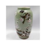 A Japanese celadon vase with relief blossom decor,