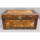 A carved camphor wood chest (feet inside), 40in wi