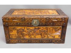 A carved camphor wood chest (feet inside), 40in wi