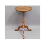 A mahogany wine table, 20in high x 11.75in diamete