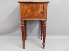 An antique mahogany pot cupboard with tapered gadr