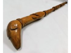 A carved folk art walking cane with Celtic love kn