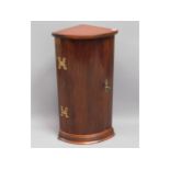A small wall mounted mahogany corner cupboard with