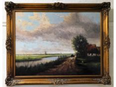 A gilt framed landscape oil, indistinctly signed,