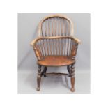 An early 19thC. elm seated Windsor chair, 37.5in h