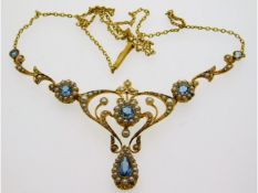 An antique 15ct gold necklace & pendant set with a