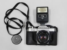 A Pentax K1000 35mm film camera with SMC Pentax 50
