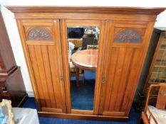 A stained satinwood compactum with mirror, 81.75in