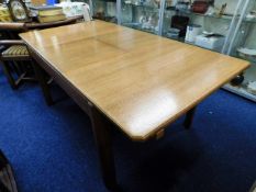 A Heals Of London oak extending dining table, 72in