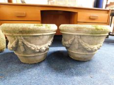 A pair of 'stoneware' garden planters with garland