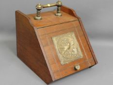 A mahogany coal scuttle with brass fittings
