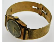 A 9ct gold wristwatch & strap by Arthur Schnegg, 2