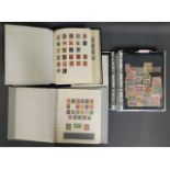 Three stamp albums including stamps from Britain,