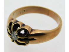 An antique 9ct rose gold ring set with 0.15ct cara