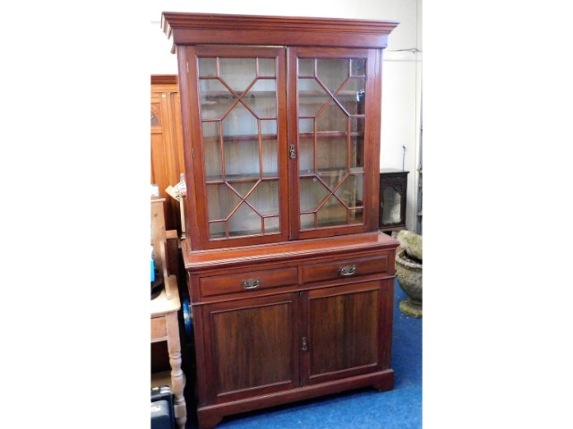 A Victorian mahogany bookcase with drawers & cupbo