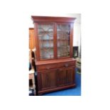 A Victorian mahogany bookcase with drawers & cupbo