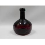 An onion shaped wine bottle, 7in tall x 4.5in wide
