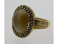 A 19thC. 18ct gold ring set with probably cymophan