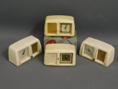 Four vintage bakelite style clocks