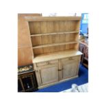 An antique pine kitchen dresser, 52in wide x 16in