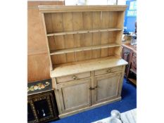 An antique pine kitchen dresser, 52in wide x 16in