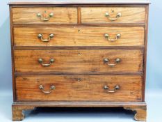 A Georgian walnut chest of drawers with brass hand