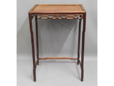 An antique Chinese hardwood table, part of a nest