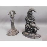 Two Victorian cast iron doorstops including Mr. Pu