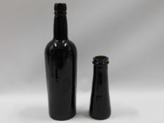 A brown coloured wine bottle, 12in tall & one othe