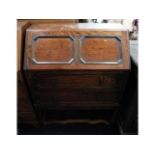 An oak bureau with two drawers, 38in high x 29.25i