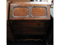 An oak bureau with two drawers, 38in high x 29.25i