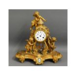 A decorative French gilt clock with Sevres style p
