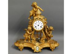 A decorative French gilt clock with Sevres style p