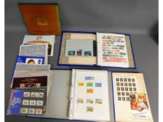 Three stamp albums including stamps from Malta, Af