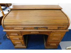 An oak roll top desk, faults to top, 48in wide x 2