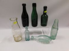 A collection of vintage bottles including R. Cundy