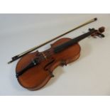 An antique violin labelled Antonius Stradivarius cremonensis faciebat 1713, two piece back, with bow