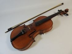 An antique violin labelled Antonius Stradivarius cremonensis faciebat 1713, two piece back, with bow