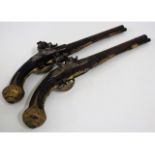 A matching pair of 18th/19thC. flintlock pistols, possibly Ottoman Empire, 18.75in long, by G. Stron