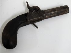 A 19thC. percussion pistol, 6in long