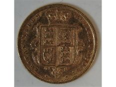 A Victorian 1884 shield back half gold sovereign,