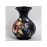 A Moorcroft pottery vase with floral decor, 5in ta