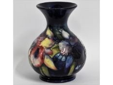 A Moorcroft pottery vase with floral decor, 5in ta